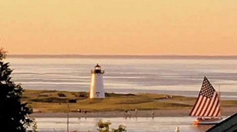 Topside Deck view of Harbor Light at Entrance & Cape Cod beyond Vineyard Sound.