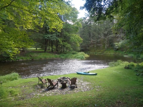 patio with fire pit to relax by the creek or kayak downstream