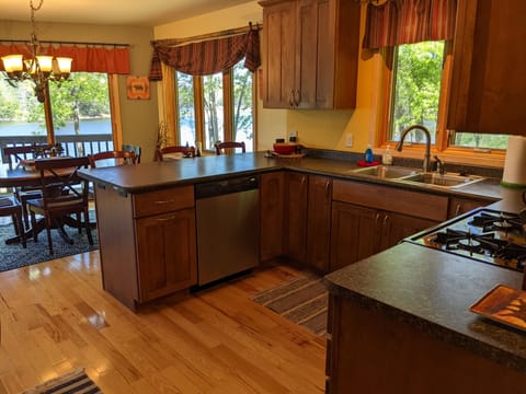 Full kitchen with stainless steel appliances & cookware