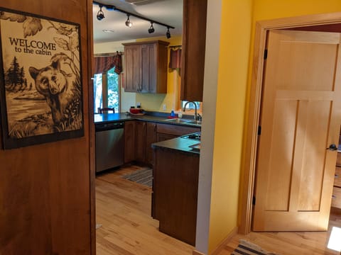 Front hallway to kitchen & main floor half bath