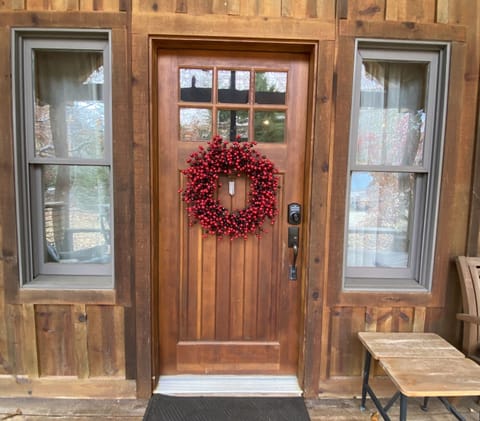 Welcoming front door with seasonal wreath.