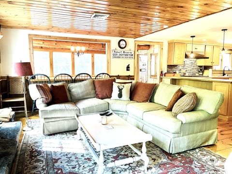 Living room with huge fireplace & river view