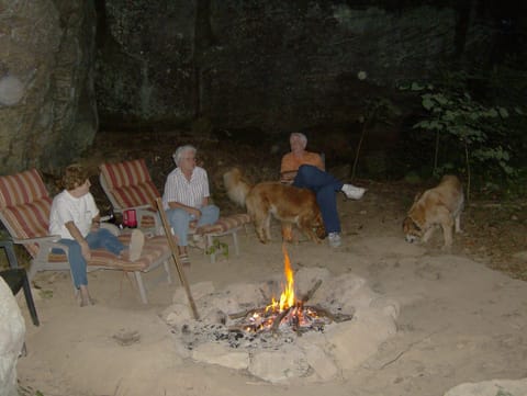 Enjoy a camp fire in a Rock Shelter just outside Big Rock Log Cabin.