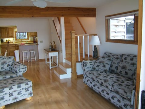 Living area has slider to deck with water just 20 feet away