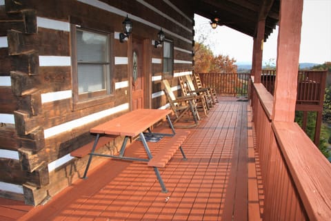 wrap around deck with plenty of rockers to enjoy the views, plus picnic table 