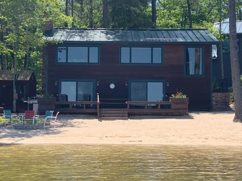 Lake Side View. 100' wide sandy beach, fire pit, kayaks and more!