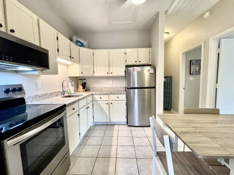 Hallway to the right is where bedrooms are, bathroom just a few steps further. (Shelves outside the bathroom seen here.)