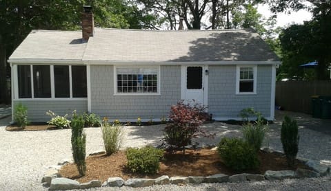 Front yard is beautifully landscaped, neat stone driveway offers ample parking