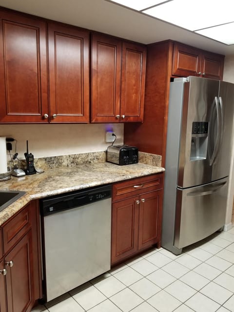 View of Fridge/Freezer & Dishwasher in Kitchen.