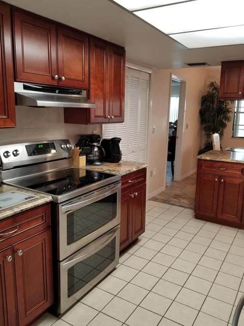 View of stove/oven & pantry in Kitchen. 