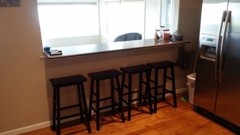 Kitchen counter looks out to the lake through the sun room