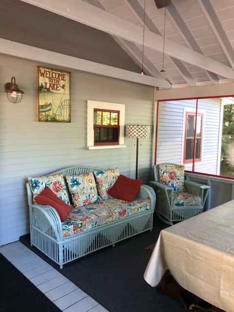 Large screened porch, with comfy couch, 2 side chairs & table with lake view