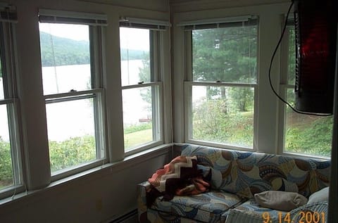 Pull out couch on front porch with lake view.  Best place for morning coffee. 