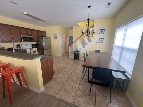 Dining room table with bench seat in back.