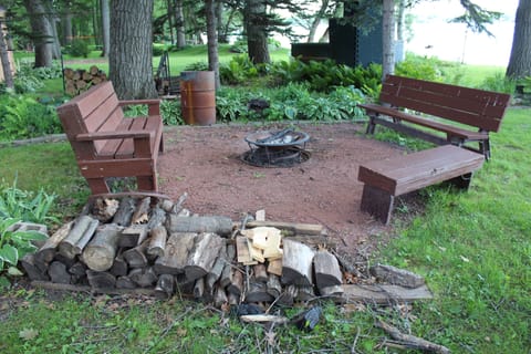 Fire pit with seating and firewood