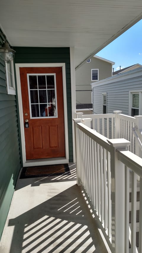 Entrance into home, with small porch.