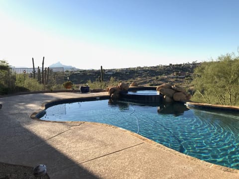 pool faces south with  city light views!