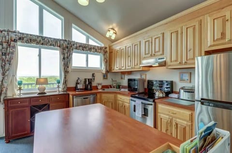 Gorgeous, all stainless steel kitchen with state-of-the-art, digital appliances.