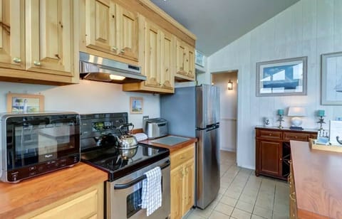 Gorgeous, all stainless steel kitchen with state-of-the-art, digital appliances.