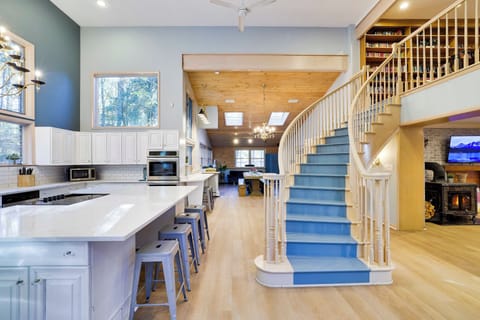 Beautiful central staircase leading from the second floor open library