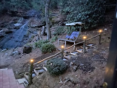 Step out to your private back area's natural setting, mountain'n *waterfall