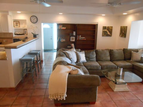 "secret' bookcase slides to reveal second bedroom or foyer to the pool deck