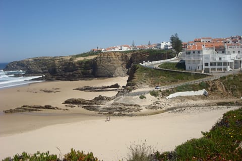 The building is the white one on the right corner in front looking at the Pic.