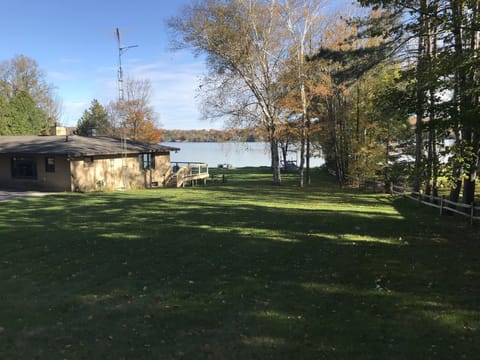 View from the large side yard - property is surrounded with a split rail fence