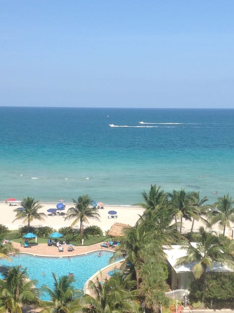 view from the balconyone of the two swimming pools and beach.