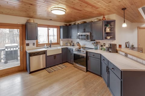 Updated kitchen opens into dining area and a second grilling deck attached.