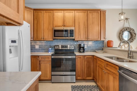 full kitchen with bar seating and dining area