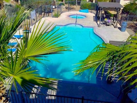 This view from Condo 9-3 looks directly onto the El Dorado Ranch community pool — just steps from your door for easy access to swimming and sunbathing.