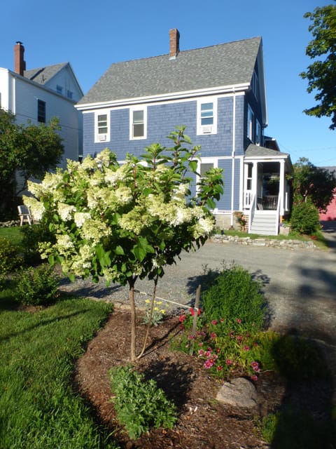 Side view of house with three parking spaces.
