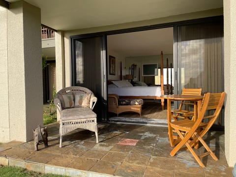 Lanai with chaise lounge, table, and chairs to enjoy the view