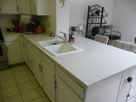 2 CEILING FANS IN KITCHEN AND EATING SPACE