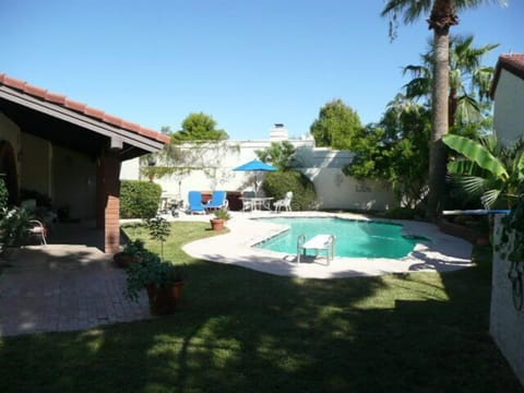 OVERVIEW OF PRIVATE FRONT YARD WITH POOL