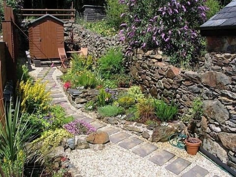 Private garden has chairs, table, and views