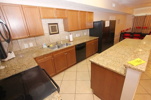 Fully stocked kitchen with two fridges.