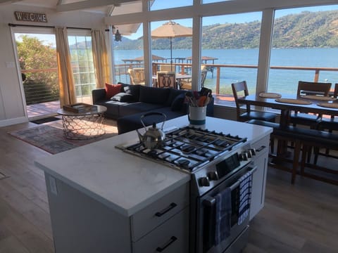 Great room includes kitchen and living room with full lake views