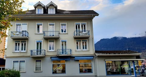 Outside building.  Your apartment is on the 1st floor with the 2 balconies