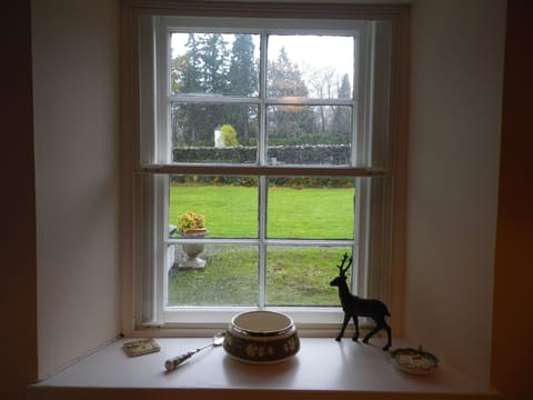 Looking out on the garden. Note the Pepperpot Lighthouse behind the canal wall.