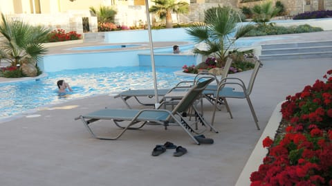 The house is right next to the pool.