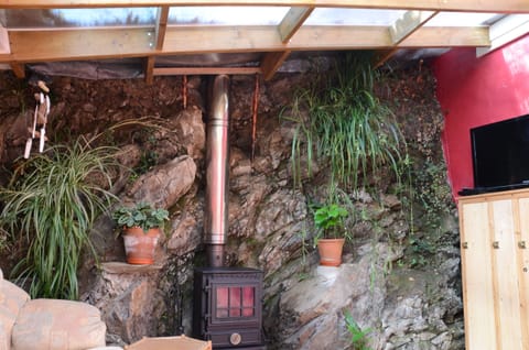 Living Rock Wall Fire Place, feet up and relax next to a fire.