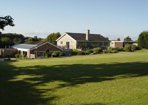 House set in 2 acres of lawns and stone patio