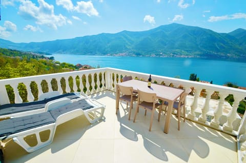 Your private balcony with sunbeds, dining room table and chairs.