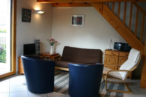 Living Area ... leading to large balcony; TV has UK channels, DVD etc