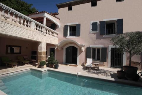 the house, swimming pool and courtyard