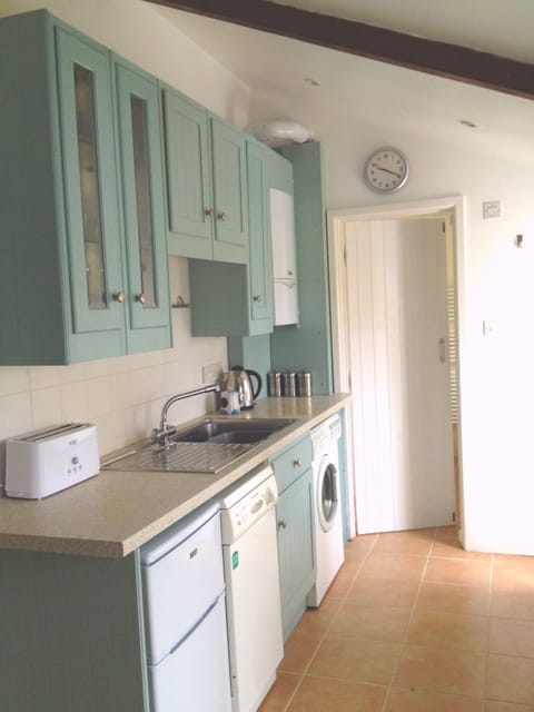 Modern, fresh kitchen with every utensil you could ever need!