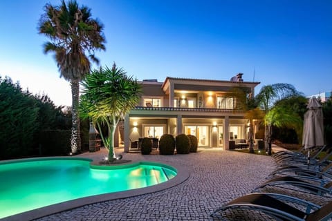 Pool and villa at night