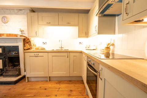 The kitchen is equipped with new fridge, dishwasher, oven and hob. 